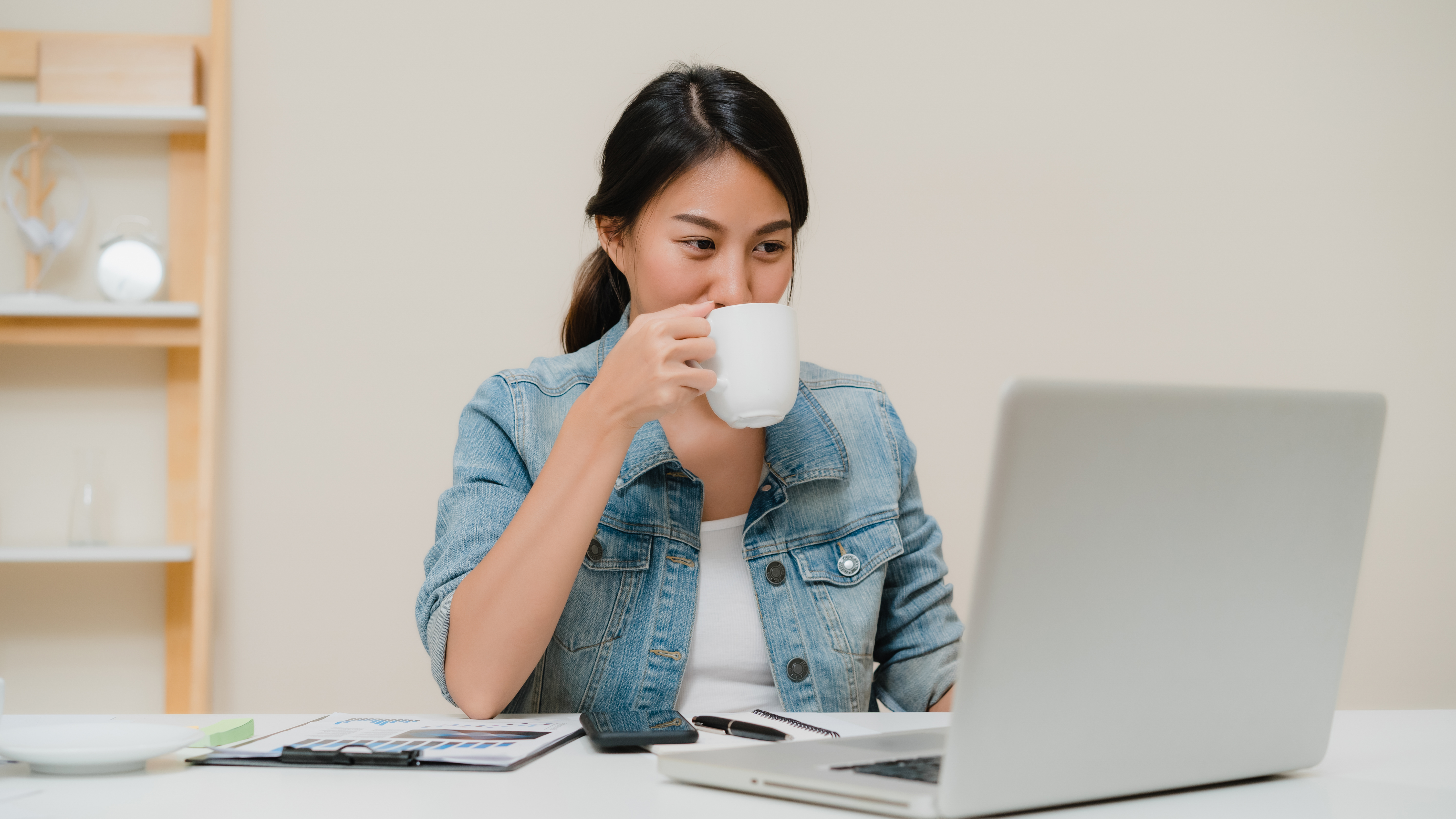 https://www.digiserve.co.id/wp-content/uploads/2021/05/beautiful-young-smiling-asian-woman-working-laptop-drinking-coffee-living-room-home.jpg